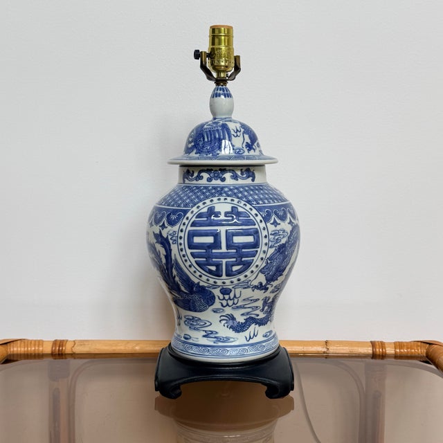 A striking vintage blue-and-white porcelain table lamp with the layered, collected feel that makes chinoiserie so...
