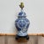A striking vintage blue-and-white porcelain table lamp with the layered, collected feel that makes chinoiserie so...