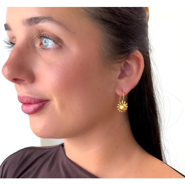 Our signature pinwheel silhouette in an earwire... Very versatile. Lightweight