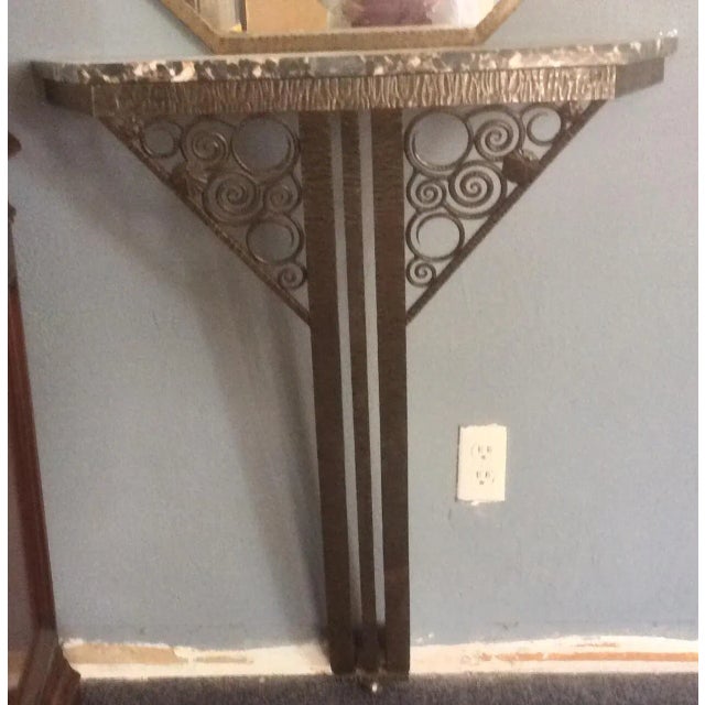 Beautiful antique marble and wrought iron Art Deco Edgar Brant style console with matching mirror. Note the dimensions of...