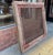 This antique architectural window frame features hand-carved floral corners, a vibrant distressed green patina, and an...