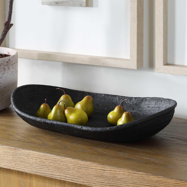 This Abstract, Oblong Bowl Features A Unique, Elongated Shape. The Surface Is Detailed With A Cast Texture, Creating A...