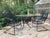 no maker’s mark Francois Carre Cantilever Garden Rocker. black and beautiful antique strap iron garden chair in amazing...