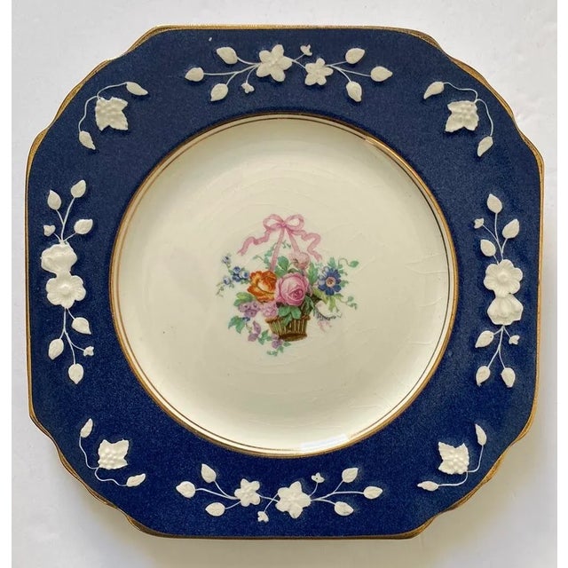 These are are a set of four vintage, pre-owned 8 1/2” by 8 1/2” plates. Beautiful blue and white with floral in the center...