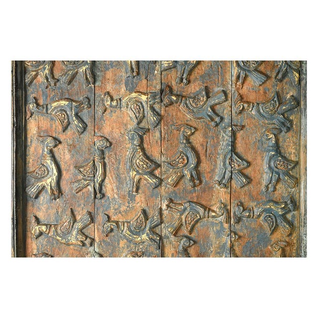 Bas-relief element in carved and patinated wood. Wall decoration in antique patinated teak. Decorative object used to...