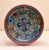 A large vintage Norwegian hand-painted wooden bowl, decorated in a rosemaling-inspired folk-art style and dating to the...