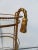 Hollywood Regency metal gold gilt rope twist stand with tassels, 3 glass shelves .