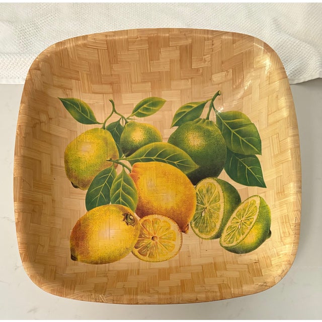 The artwork is so detailed that you can almost taste the juice from the lemon and lime slices on this vintage woven bamboo...