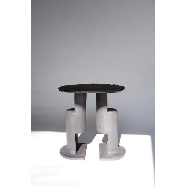 T01 coffee table by ia kutateladze one of a kind. Dimensions: d 38 x h 37 cm. Materials: black clay. Each piece is one of...