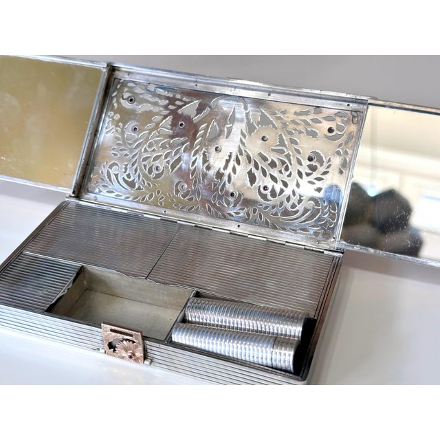 A large silver compact case with gilt surface and inset rubies by Boucheron Paris circa 1930s-1940s, of Art Deco period...