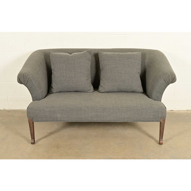 A gorgeous English Regency style rolled arm sofa, settee, or loveseat By Baker Furniture USA, Circa Early 21st Century...