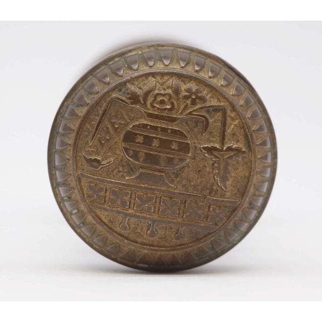 This Vernacular style asymmetrical bronze door knob was made by Lockwood in the 1887 catalog. It is part of the B-12600...