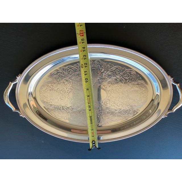 The Vintage Oneida Oval Serving Tray is a classic and elegant piece of metalware that exudes sophistication. Made from...