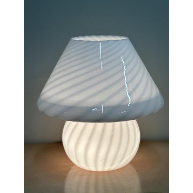 A beautiful 1970s swirl-glass murano mushroom lamp crafted in white opaline glass with a subtle spiral pattern that glows...