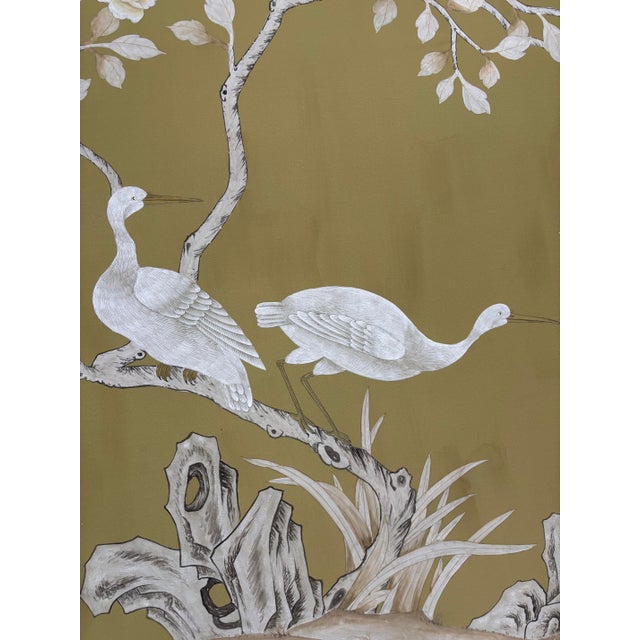 A sophisticated hand painted Williamsburg-inspired chinoiserie wallpaper mural featuring elegant flowering branches,...