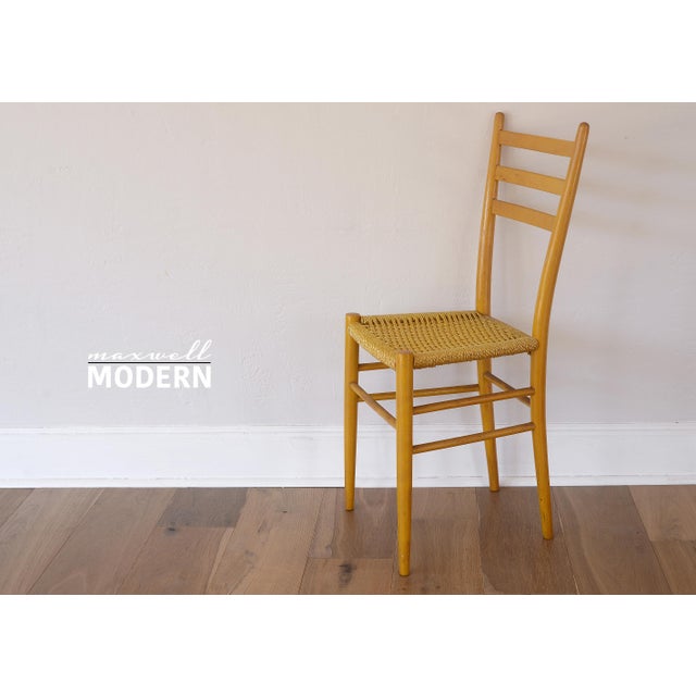 Vintage 1950s chair in the style of Gio Ponti with yellow painted finish and a rarely seen plastic woven seat that...