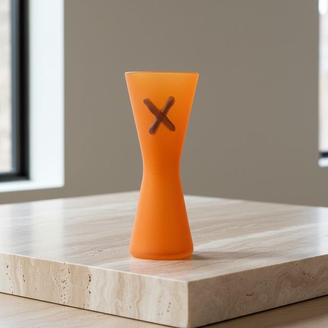 This striking vintage studio art glass vase features a satin-frosted translucent orange body. Accented with applied...