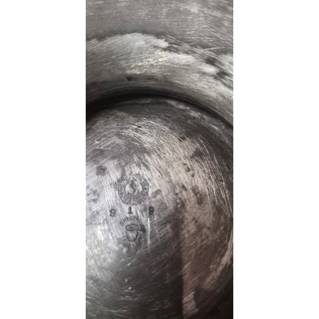 This item is an antique silver-plated pedestal fruit or rose bowl manufactured by the Homan Silver Plate Company.About the...