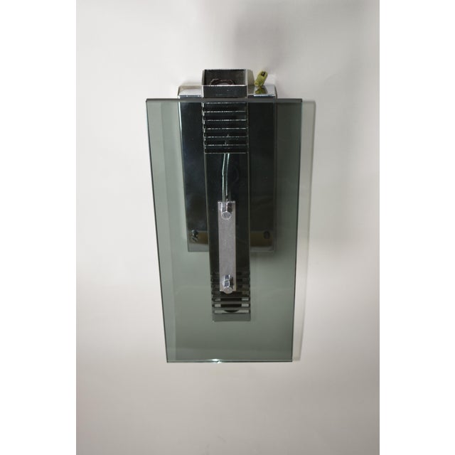 Chrome-plated brass sconce with two E14 bulbs up to 60 watts, designed by Gaetano Sciolari in the 1970s (attributed). One...