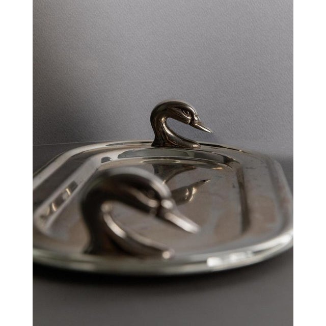 This vintage silver-plated tray from 1960s France is an elegant oval design distinguished by its twin swan head handles. A...