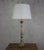 Beautifully turned bronze and brass give this French table lamp from the 1940s its refined character and timeless appeal....