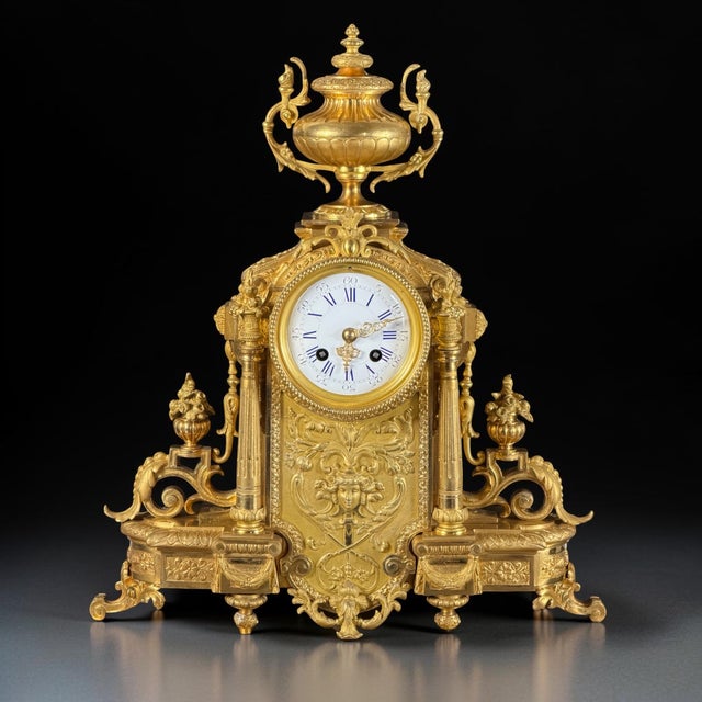 An exceptionally elaborate French three-piece mantel clock garniture dating to the second half of the 19th century, circa...