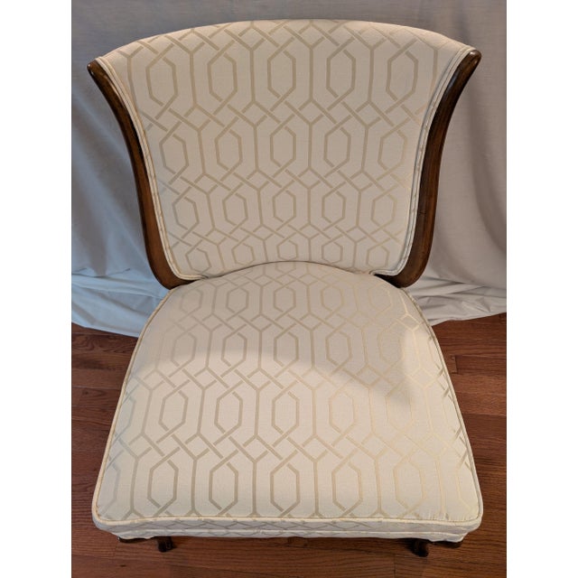 A French=style slipper chair that has been re-upholstered in an ivory color geometric pattern. Perfect seating for putting...