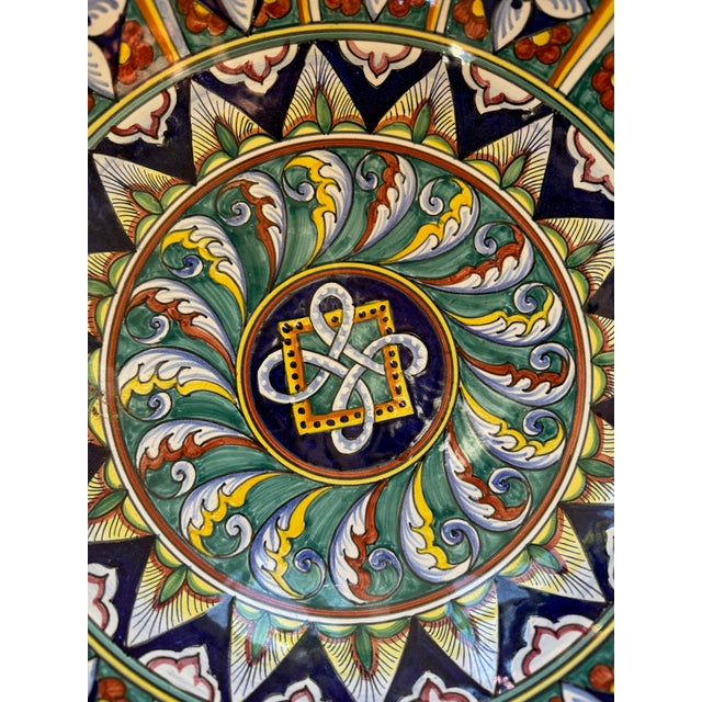 Gorgeous Italian ceramic decorative bowl made in Italy for Cottura. Vibrant motifs and colors. Handmade and painted.