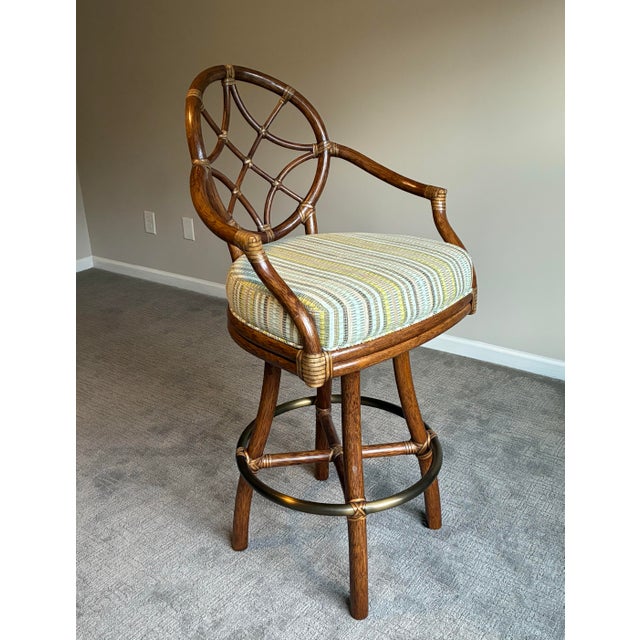 Exceptional set of three authentic McGuire San Francisco swivel bar stools showcasing the brand’s world-renowned...