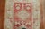 an early 20th-century Turkish Oushak Runner in soft coral red with a geometric design. You can find a few pigeons on the...