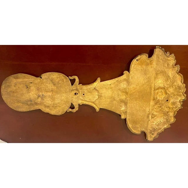 Large Roman style bronze figural architectural element, depicting a goddess holding on her head an acanthus column with a...