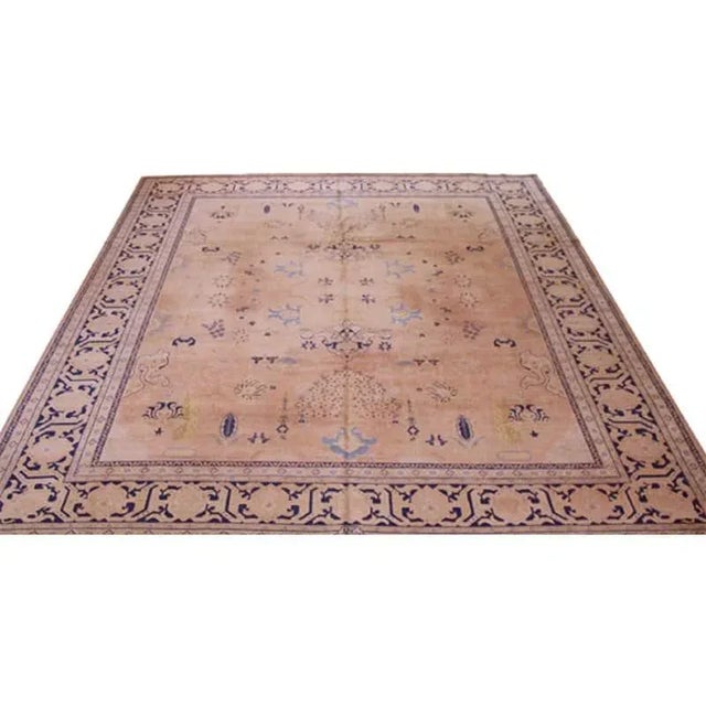 ACTUAL SIZE: 10’3″ x 13’1″ PRIMARY COLOR: Beige / Brown AGE: Antique MATERIALS: Wool FOUNDATION: Cotton PRODUCTION:...