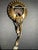 This 1940s Retro Modern costume brooch signed CRC and gold filled. It features a concave gold-tone disc with a scalloped...