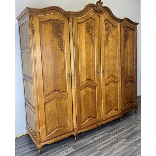 This Vintage French Louis wardrobe is a grand and elegant storage piece, crafted in oak and displaying refined French...