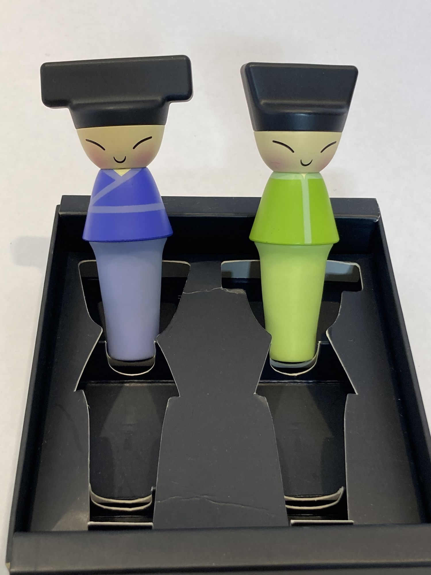 A Di Alessi King and Queen Chin Set of 2 Bottle Stops in Blue and