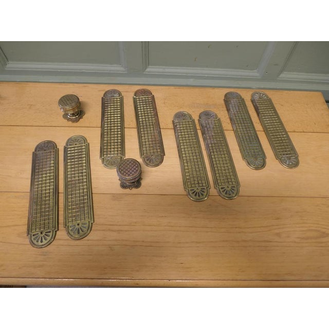 A Set of Heavy Arts and Crafts Brass Door Finger Plates and Knobs There are 8 identical plates in this set, they are...