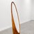 Vintage sculptural floor mirror made from bamboo and pencil reed rattan with a warm amber-brown finish. The tall, slender...
