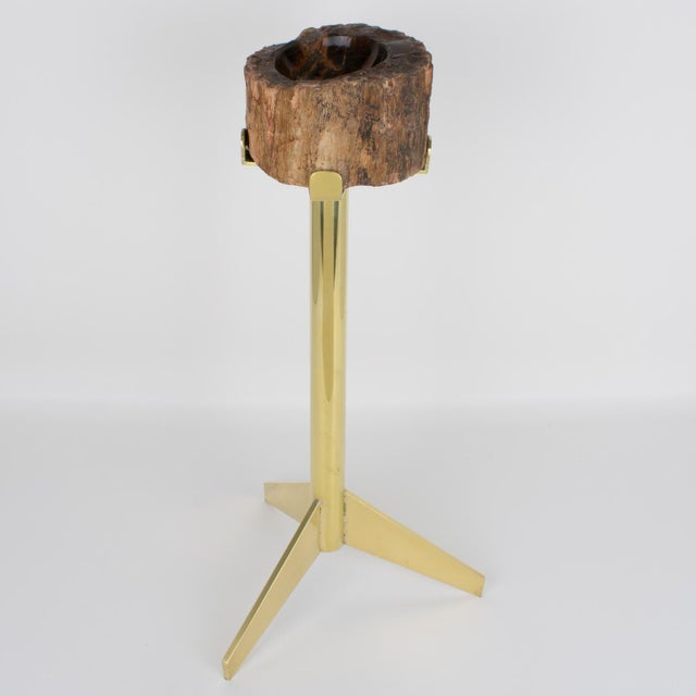 This stunning side table with vide-poche was crafted in France circa 1960. The rare geometric, three-foot polished brass...