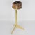 This stunning side table with vide-poche was crafted in France circa 1960. The rare geometric, three-foot polished brass...