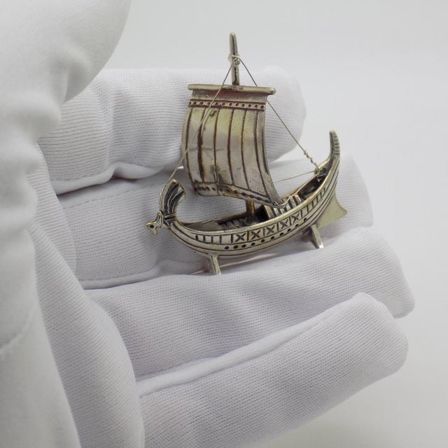 A vintage object depicting a miniature antique sailing ship, handcrafted in Italy between the 1980s and 1990s in authentic...