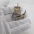 A vintage object depicting a miniature antique sailing ship, handcrafted in Italy between the 1980s and 1990s in authentic...