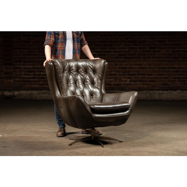 Vintage swivel wingback chair and ottoman pair. This set is a perfect example of why MCM furniture is so desirable. The...