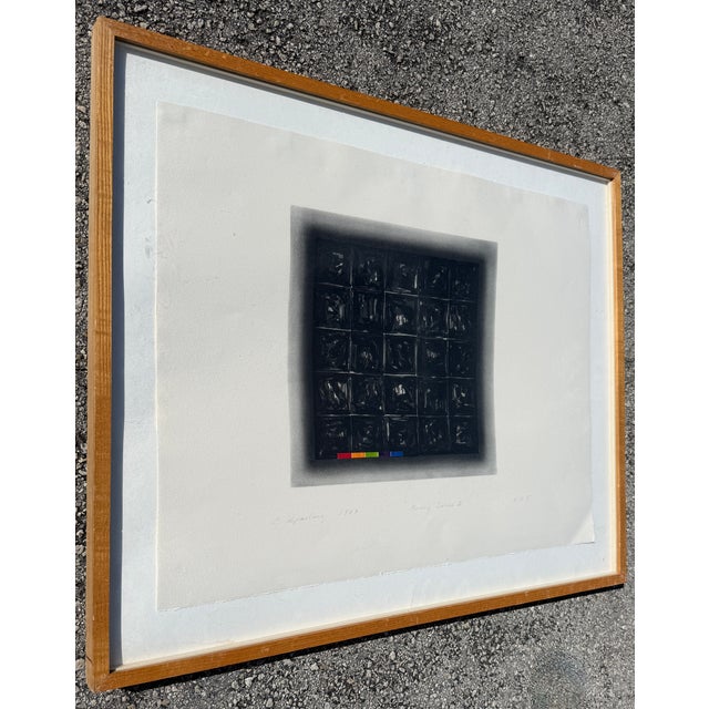 Interesting abstract artwork featuring a grid of squares in black, grey and white tones. Hand signed C. Aiperling, dated...