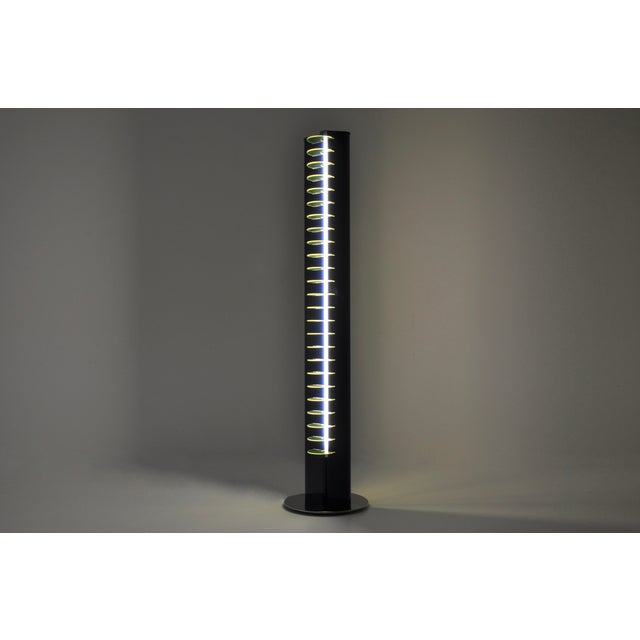 A blue and fluorescent yellow metal and plastic floor lamp designed by Vittorio Gregotti in the 1960s. Model: Amalasuntta....