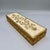 A charming Florentine giltwood box, hand-carved in low relief with a flourish of acanthus scrollwork across an ivory...