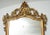 Neapolitan Louis Philippe mirror from the first half of the 19th century, entirely carved, engraved, and gilded with gold...