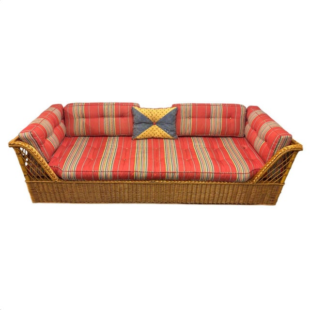 Perfect McGuire wicker couch with red and multicolored striped cushions. Can set 4 to 6 people. Made in the 90s but the...
