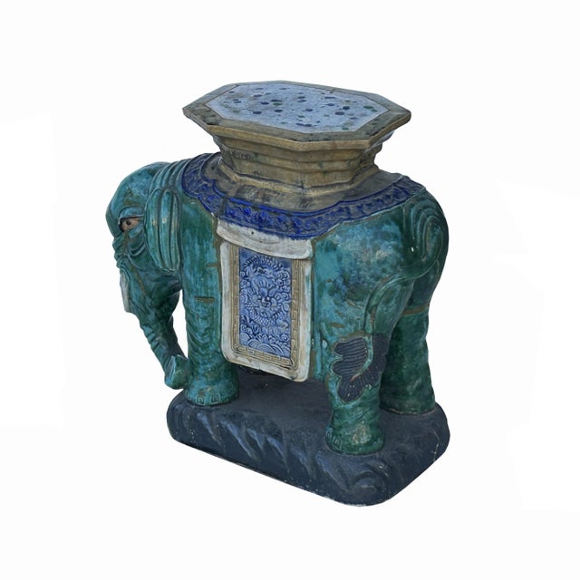 Introducing a captivating piece of traditional Chinese artistry, this decorative elephant figure is expertly crafted from...