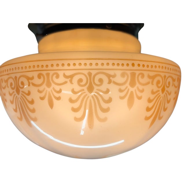 Milk glass gumdrop shaped schoolhouse shades are mounted on antique holder ring. Currently a single socket inside, but we...