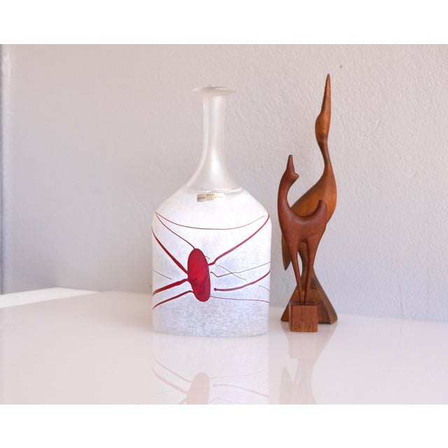 An amazing and rather tall vintage handblown studio production art glass vase known as "Red Galaxy" made by Bertil Vallien...